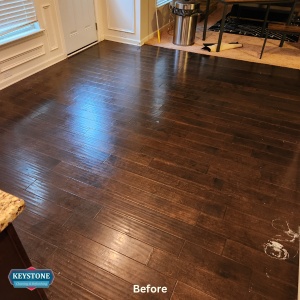 brown engineered hardwood floors in kitchen before a cleaning