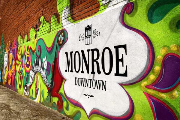 welcome mural for the city of monroe ga