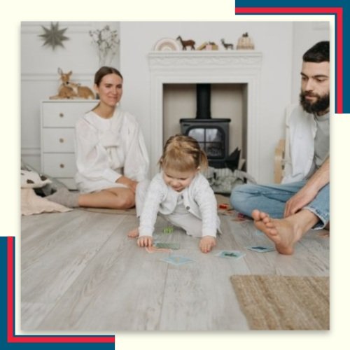 family sitting on clean hardwood floors